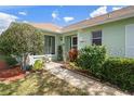 House exterior with walkway and landscaping at 8360 High Point Cir # 3, Port Richey, FL 34668