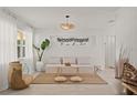 Bright and airy living room with neutral decor and natural elements at 1108 66Th Nw St, Bradenton, FL 34209