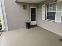 Small front patio with door and window at 5265 E Bay Dr # 420, Clearwater, FL 33764