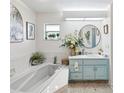 Spa-like bathroom with a large tub and updated vanity at 1096 Florian Way, Spring Hill, FL 34609