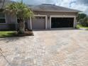 Two-car garage with paved driveway at 11033 Baywind Ct, Weeki Wachee, FL 34613