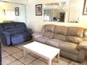 Comfortable living room featuring plush seating and neutral decor at 20861 Haulover Cv # C4, Lutz, FL 33558
