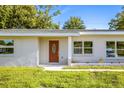 Newly renovated single story home with a modern facade and well-manicured lawn at 6921 38Th N Ave, St Petersburg, FL 33710