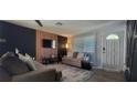 Bright living room with modern wall decor and comfy seating at 3814 Holiday Lake Dr, Holiday, FL 34691