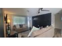 Spacious living room featuring a dark accent wall and ample natural light at 3814 Holiday Lake Dr, Holiday, FL 34691