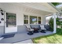 Relaxing front porch with mid-century modern furniture at 6642 Stewart N Ave, St Petersburg, FL 33702