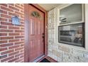 Inviting front door entrance with brick and stone facade at 6635 Stewart N Ave, St Petersburg, FL 33702