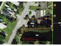 Aerial view showing home's lot lines and canal access at 14904 Old Dixie Hwy, Hudson, FL 34667