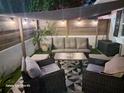 Relaxing patio area with wicker furniture and string lights at 5348 Dartmouth Rd, New Port Richey, FL 34652