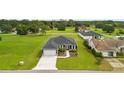 Aerial view showcasing the home's curb appeal and spacious lot at 5406 Boxtree Ct, Dade City, FL 33523