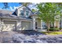 Two-story townhome with double garage and nicely landscaped front yard at 3605 Kings Rd # 102, Palm Harbor, FL 34685