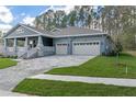 Well-designed craftsman-style residence with a three-car garage and inviting curb appeal at 3898 Southern Valley Loop, Brooksville, FL 34601