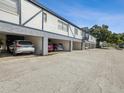 Covered parking area with multiple parking spots at 1127 King Arthur Ct # 305, Dunedin, FL 34698