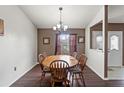 Simple dining room with wooden table and chairs at 3077 Ardenwood Dr, Spring Hill, FL 34609