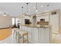 Spacious kitchen with white cabinets, granite counters and island at 13931 Chandron Dr, Odessa, FL 33556