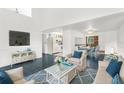 Open living space with kitchen and dining area, featuring a modern design at 10221 Elgin Blvd, Spring Hill, FL 34608