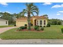 Single-Gathering home with brick driveway and palm tree at 9312 Gentle Ben Ct, Weeki Wachee, FL 34613
