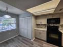 Updated kitchen with stylish backsplash and white cabinets at 3728 Sailmaker Ln # 1702, Holiday, FL 34691