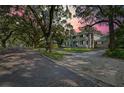 Two story home with blue shutters and a wrap around porch at 321 S Brooksville Ave, Brooksville, FL 34601