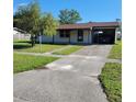 Front view of a ranch-style home at 9171 Century Dr, Spring Hill, FL 34606