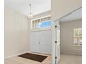 Bright and airy foyer with double doors, high ceilings, and access to other rooms at 4264 Braemere Dr, Spring Hill, FL 34609