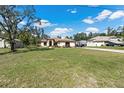 House with a large yard and driveway at 12233 Pitcairn St, Brooksville, FL 34613