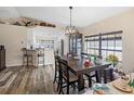 Bright dining area with a spacious table and view into the kitchen at 12233 Pitcairn St, Brooksville, FL 34613