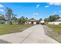 House with a large yard and long driveway at 12233 Pitcairn St, Brooksville, FL 34613