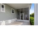 Covered patio with a screened enclosure for outdoor enjoyment at 6150 Ivory Bill Dr, Englewood, FL 34224