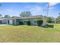 Single story home with a two-car garage and a well-maintained lawn at 9130 Horizon Dr, Spring Hill, FL 34608