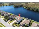Two-story home with lake view in a quiet community at 12135 Crestridge Loop, Trinity, FL 34655