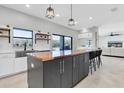 Kitchen with island, wood countertop and lake view at 12135 Crestridge Loop, Trinity, FL 34655
