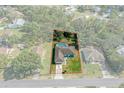 Bird's-eye view of a house with a pool, showcasing its location and lot size at 3018 Greynolds Ave, Spring Hill, FL 34608