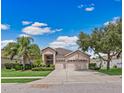 Beautiful two-story house with a three car garage at 13517 Hunters Point St, Spring Hill, FL 34609