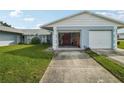 2-car garage with one door open at 8833 Manos Cir # 8833, New Port Richey, FL 34655