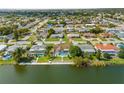 Aerial view of waterfront home with private pool at 10316 Amadeus Dr, Port Richey, FL 34668