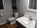 Clean bathroom with gray vanity, white subway tiles, and modern fixtures at 9401 Bourbon St, New Port Richey, FL 34654