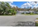 Large two-story house with a three-car garage at 7222 Auburn Ln, New Port Richey, FL 34654