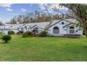 Large house with a three-car garage and expansive lawn at 7222 Auburn Ln, New Port Richey, FL 34654