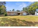 Single-story house with attached garage and large yard at 13242 Little Farms Dr, Spring Hill, FL 34609