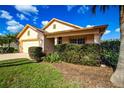 Single-story house with a two-car garage and manicured lawn at 20743 Nectarine Pl, Land O Lakes, FL 34637