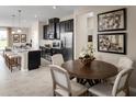 Modern kitchen with dark cabinetry and granite countertops at 4628 Spire Run, Lakewood Ranch, FL 34211