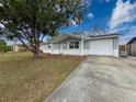 Updated single story house with a large front yard at 11231 Snyder Ave, Port Richey, FL 34668