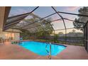 The enclosed pool is perfect for outdoor living with a screen and plenty of space at 6450 Trade Ct, Spring Hill, FL 34606