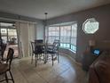 Kitchen dining area with bay window and table for four at 11185 Mercedes St, Spring Hill, FL 34609