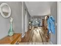 Bright entryway with hardwood floors, showcasing a glimpse into the living area at 2533 Wood Pointe Dr, Holiday, FL 34691