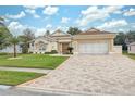 Attractive one-story home with a large driveway and well-manicured lawn at 3527 Conifer Loop, Spring Hill, FL 34609