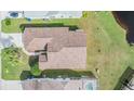 Aerial view of house with brown roof and green lawn at 4222 Northampton Dr, New Port Richey, FL 34653