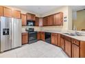 Well-equipped kitchen featuring stainless steel appliances and wood cabinets at 7650 Red Mill Cir, New Port Richey, FL 34653
