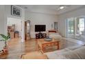 Spacious living room with hardwood floors and sliding doors at 16715 Kerry Hills Ln, Spring Hill, FL 34610